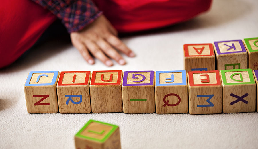 Child Playing with Cubes