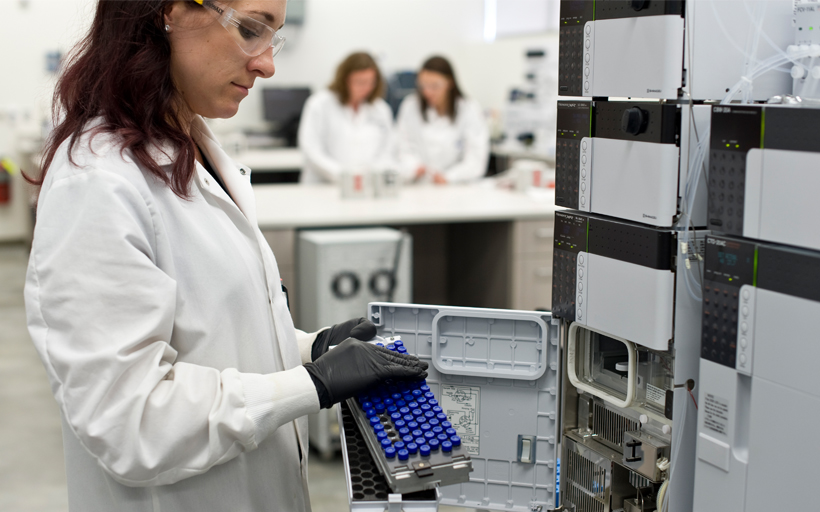 Scientist Holding Test Tubes